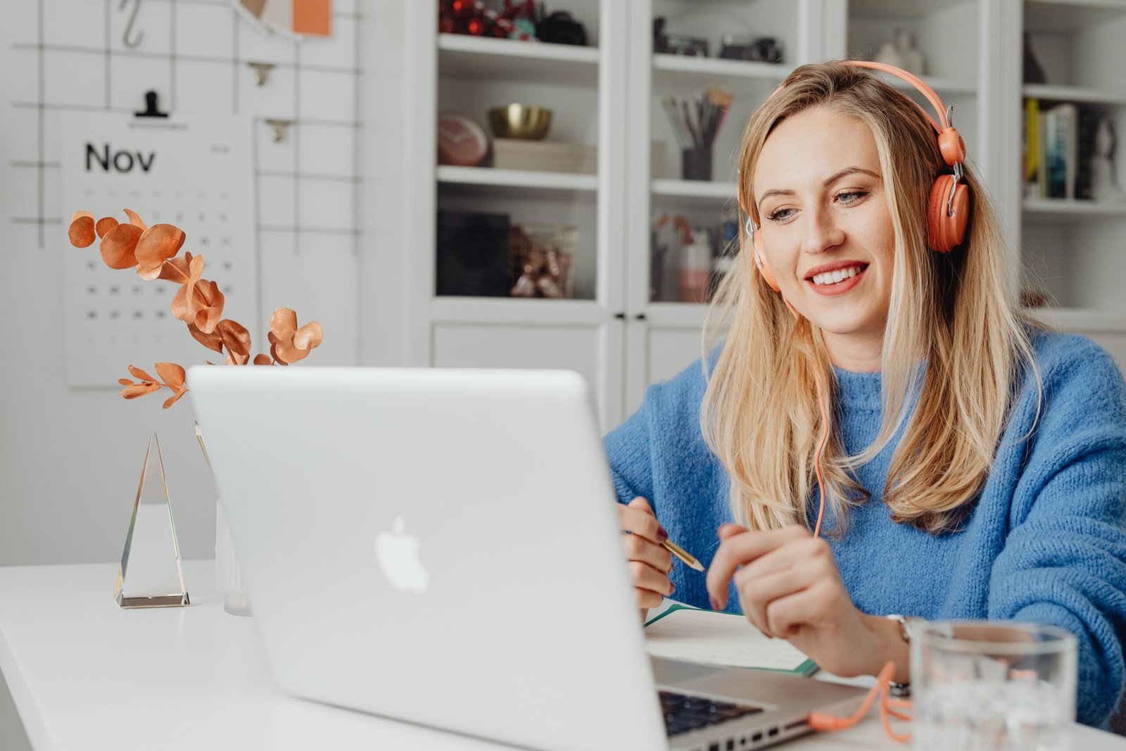 Wedding planner on a video call with a client from her desk