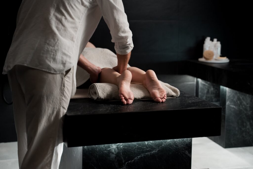 A person massaging in a tranquil spa treatment room