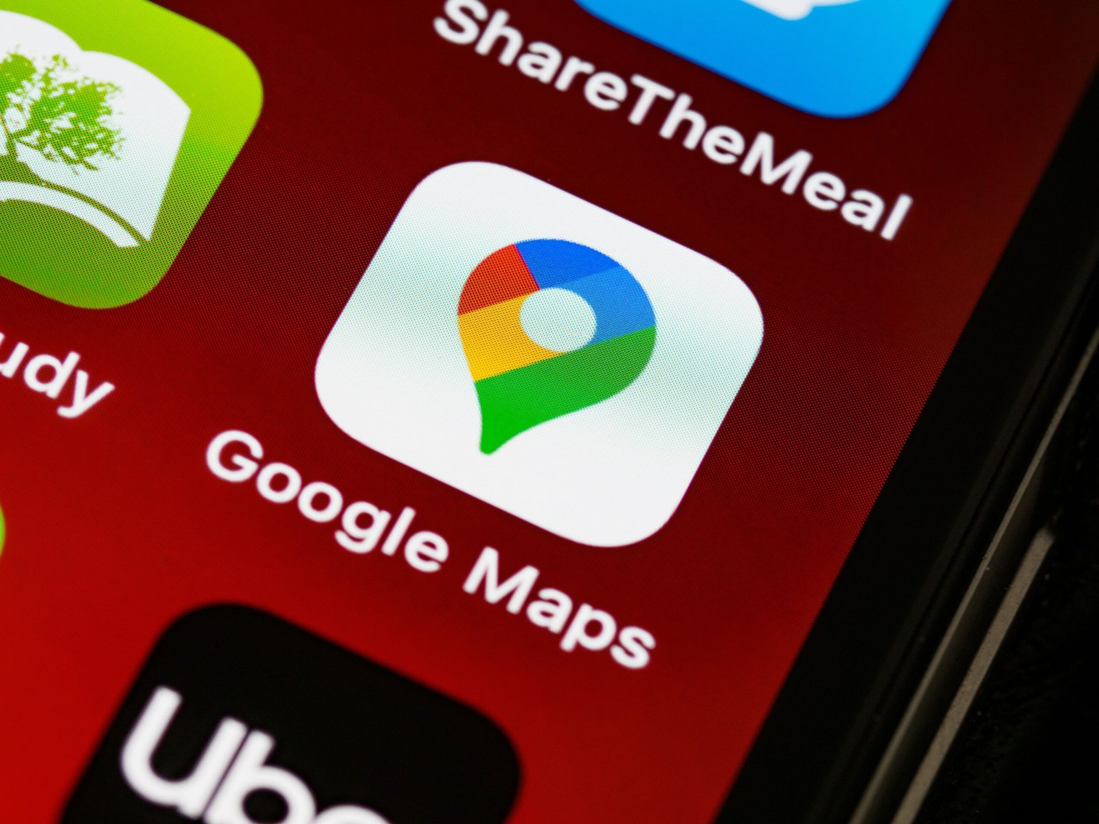 Smartphone showing a google maps logo on screen